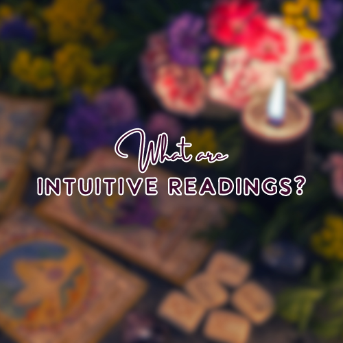 what are intuitive readings heading with tarot cards, runes, and other divination tools in the background 